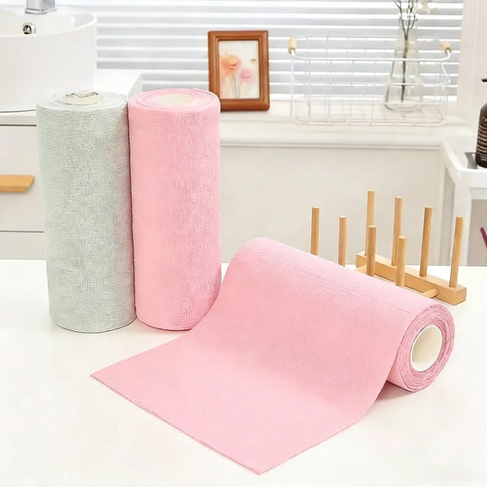 Reusable Microfiber Cleaning Cloths – 20-Pack Roll in pink and gray, displayed on a table in a bright interior.